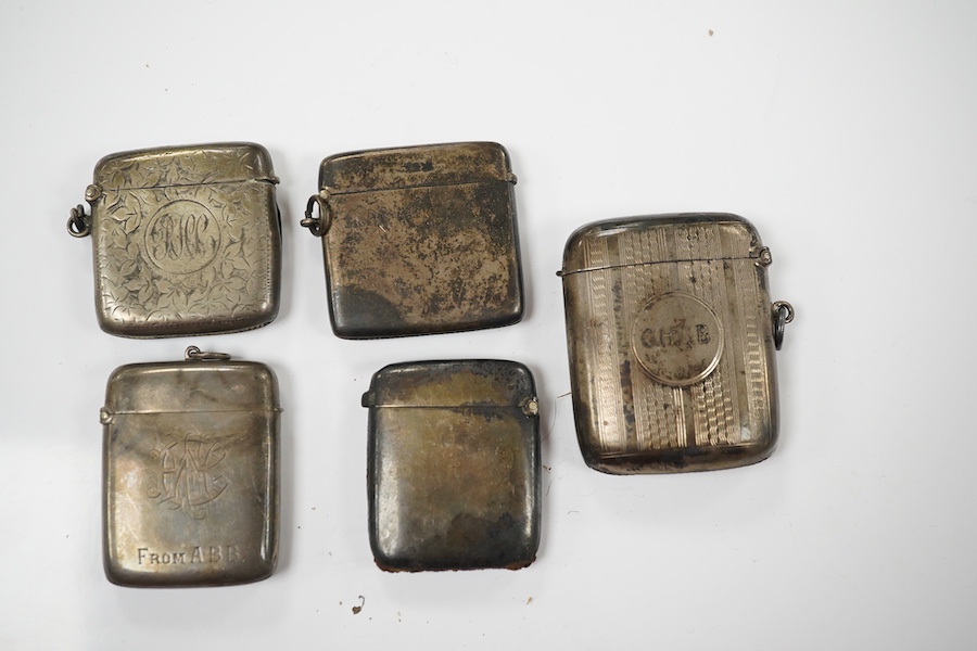 Five assorted late 19th/early 20th century silver vesta cases, largest 58mm. Condition - poor to fair